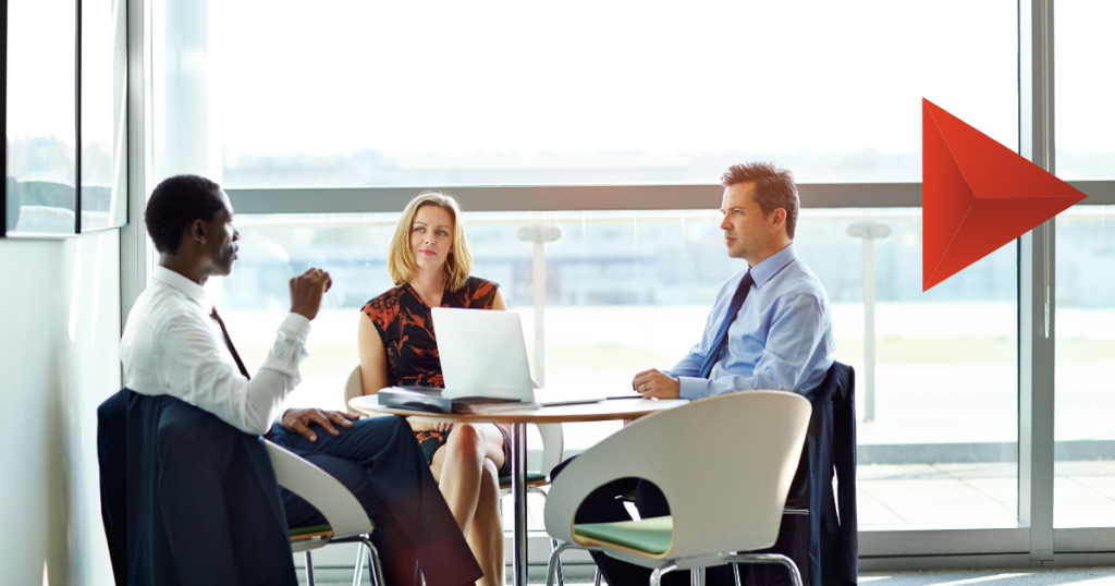 Senior decision-makers reviewing research results in a meeting, illustrating B2B survey response rates