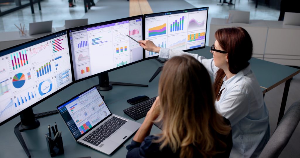 Woman Studies Financial Dashboard On Laptop Sharing Insights | Quest Mindshare Researcher applying data quality tips to reduce data cleaning time