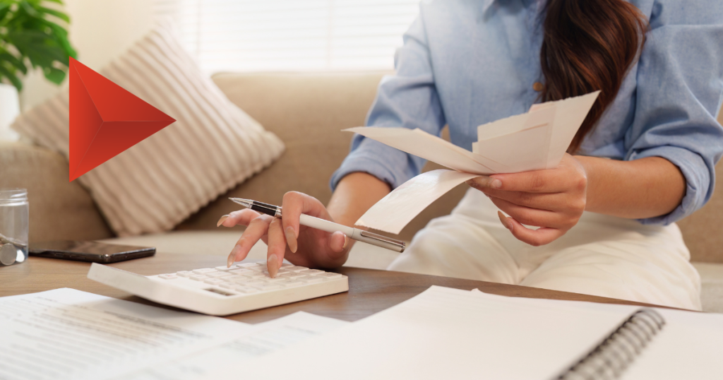 Couple reviewing bills at the kitchen table, illustrating why household income in market research needs context
