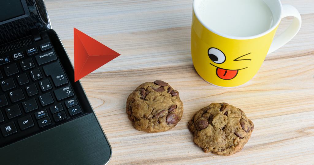 Crumbled cookie beside a laptop, symbolizing the shift from third-party cookies to first-party data