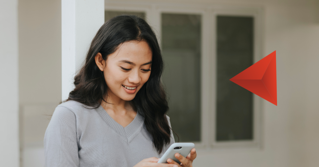 Woman smiling while answering a survey on her phone, illustrating survey respondent motivation