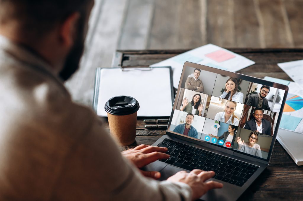 Remote Video Call – Continuous Market Research | Quest Mindshare Person on a video call with remote colleagues, showing how fast change made continuous market research essential